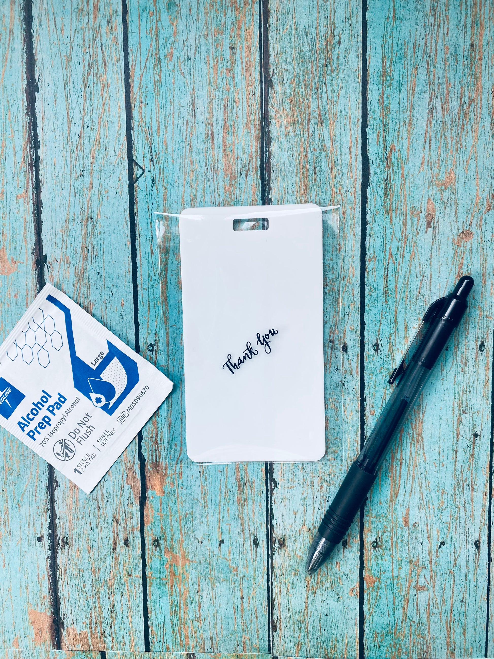 This erasable notepad is the perfect pocket-sized accessory for nurses. Easily write on it with any pen and wipe it clean with a wet cloth or alcohol pad. Made of lightweight soft silicone, it's a nurse's essential for taking notes on the go. Attach it to your ID badge for convenience.